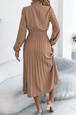 FJØRNA solid color long-sleeved fitted waist pleated midi dress featuring elegant design and flowing fabric.