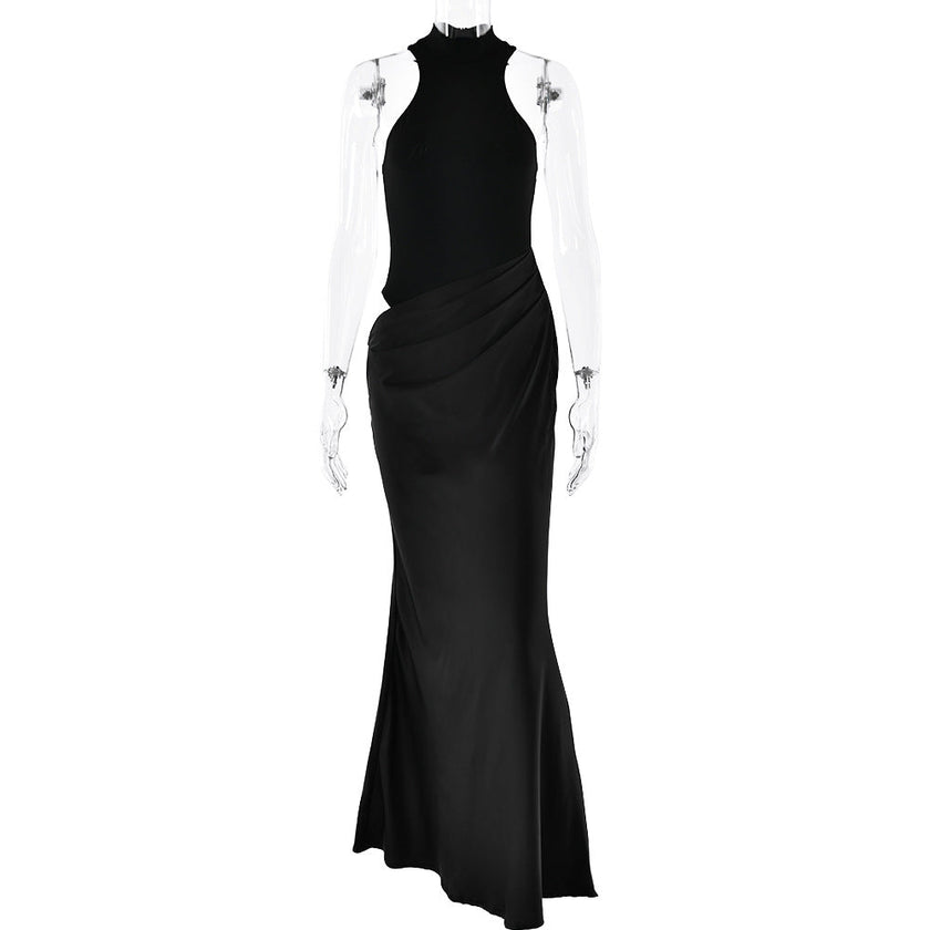 FJØRNA elegant halter draped evening dress with flowing fabric and stylish neckline, perfect for formal occasions.