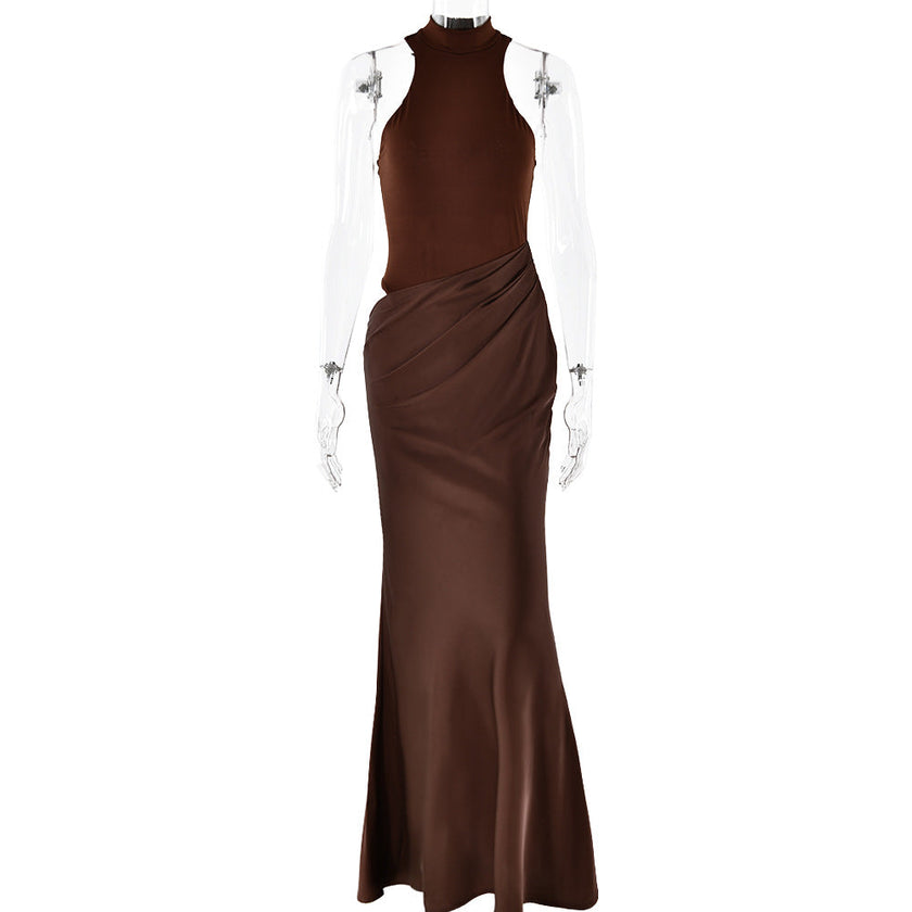 FJØRNA elegant halter draped evening dress in black, featuring a fitted bodice and flowing skirt for formal occasions.