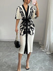 FJØRNA white midi dress with half sleeves, floral print, tied waist, and V-neck design, perfect for casual or summer wear.