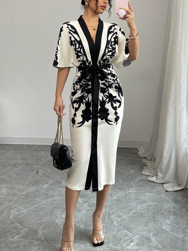 FJØRNA white midi dress with half sleeves, floral print, tied waist, and V-neck design, perfect for casual or summer wear.