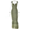 FJØRNA ruched mermaid evening dress in elegant fabric, fitted silhouette with flared hem and intricate design details.