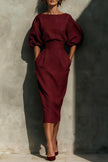 White FJØRNA puff sleeve high-waisted midi dress with pockets, casual style, featuring elegant design and relaxed fit.