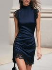 Navy satin mini dress by FJØRNA with black lace trim, featuring a fitted silhouette and elegant short sleeves.