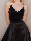FJØRNA satin ruffled midi dress with spaghetti straps, featuring a flowing design and elegant details for stylish occasions.