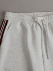FJØRNA retro sporty grey and white sleeveless sweatshirt and matching shorts set, casual athletic wear for women.