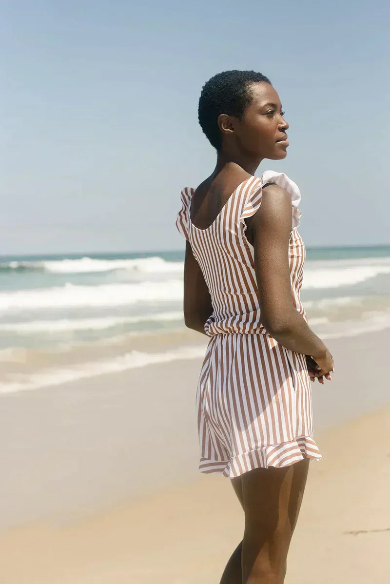 FJØRNA women's summer tankini set with ruffles and V-neck, featuring a stylish two-piece swimsuit with colorful patterns and flared design.