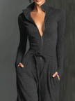 FJØRNA women's sparkling knit jumpsuit with zip front, long sleeves, and wide-leg pants, stylish and comfortable for any occasion.