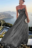 FJØRNA Celeste women's strapless A-line evening gown with pleated metallic fabric, elegant and stylish for formal occasions.