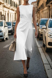 FJØRNA solid color sleeveless round neck casual midi dress hanging on a wooden hanger