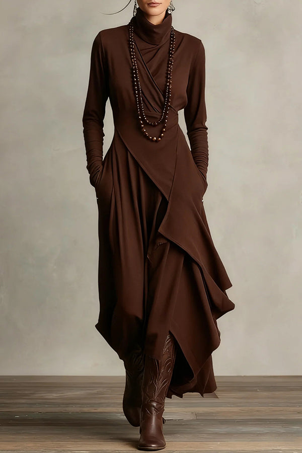 FJØRNA solid color high-neck long-sleeved irregular casual maxi dress displayed on a hanger, showcasing its elegant design.