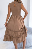 FJØRNA solid color sleeveless tucked patchwork casual midi dress displayed on a model, showcasing its relaxed style and design details.