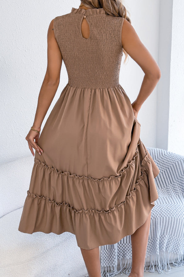 FJØRNA solid color sleeveless tucked patchwork casual midi dress displayed on a model, showcasing its relaxed style and design details.