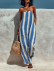 Loose-fit striped suspender jumpsuit for women by FJØRNA, featuring wide-leg pants perfect for vacation style and casual wear.