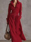 FJØRNA high waisted maxi dress with long sleeves, pleated pockets, button details, and a split-joint lapel in solid color.