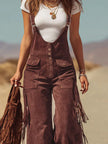 FJØRNA brown micro suede tassel wide-leg overalls with adjustable straps and front pockets, styled on a mannequin.
