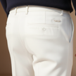 FJØRNA men's slim fit trousers in dark fabric, tailored pants with a modern, streamlined design and classic waistband.