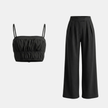 Women’s summer co-ord set by FJØRNA featuring a crop top and wide-leg pants in lightweight fabric.