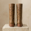 Tan leather knee-high men's boots with block heels from FJØRNA, featuring a stylish and sturdy design.