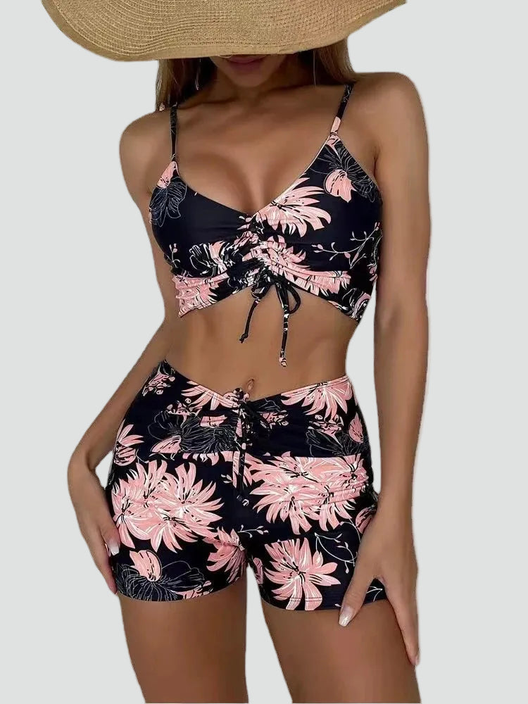 FJØRNA women's printed tankini set showing a stylish, flattering fit with colorful pattern and supportive tankini top and bottoms.