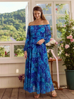 FJØRNA women's floral summer maxi dress featuring a flowy, lightweight fabric with a vibrant floral pattern and sleeveless design.