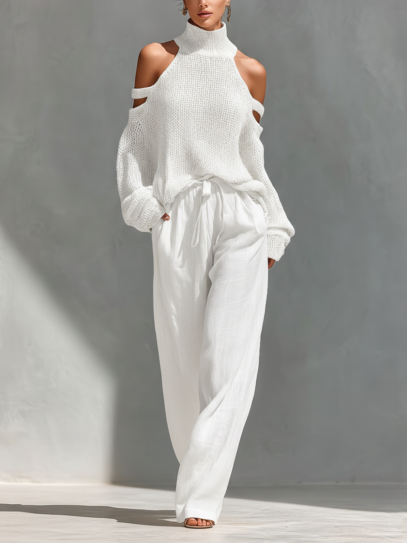 Women’s beige linen-blend high-waisted wide-leg trousers with pockets by FJØRNA, shown hanging with a relaxed fit and natural fabric texture.