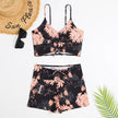 Women's printed FJØRNA tankini set with flattering fit, featuring colorful pattern and supportive swimwear design.