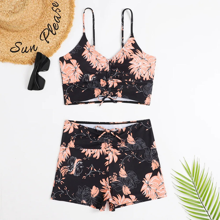 Women's printed FJØRNA tankini set with flattering fit, featuring colorful pattern and supportive swimwear design.