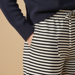 Women’s FJØRNA striped drawstring trousers, casual pants with a relaxed fit and comfortable waistband, featuring a stylish stripe pattern.