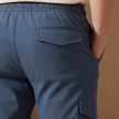 FJØRNA men's cargo trousers with drawstring waist and relaxed fit, casual pants designed for comfort and everyday wear.