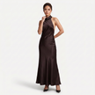 Women's satin halter maxi dress by FJØRNA featuring an open back and cowl neck, suitable for formal evening occasions.