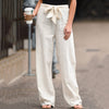 FJØRNA Jane women's wide-leg pants with high waist and drawstring, casual style, shown in black fabric.