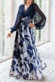 FJØRNA floral print V-neck balloon sleeve maxi dress, perfect for wedding guest attire, featuring a flowy silhouette and vibrant floral pattern.