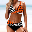 FJØRNA women's bikini set with a stylish wrap top, featuring a vibrant, patterned design perfect for summer beach wear.