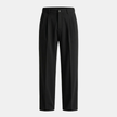 FJØRNA men's pleated relaxed fit trousers, stylish and comfortable pants with a tailored design, shown in a natural pose.