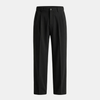 FJØRNA men's pleated relaxed fit trousers, stylish and comfortable pants with a tailored design, shown in a natural pose.