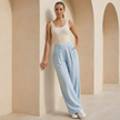 Women’s wide leg trousers with criss cross waist design from FJØRNA, featuring a stylish and comfortable fit.