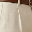 FJØRNA men's linen blend straight leg trousers with relaxed fit, shown in a natural fabric texture and classic pant style.