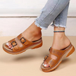 FJØRNA orthopedic comfort fit slide sandals with perforated open toe design, beige color, and cushioned footbed.