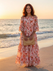 FJØRNA women's floral ruffle summer maxi dress, flowing fabric, sleeveless design, vibrant floral print, perfect for warm weather.