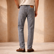 FJØRNA men's slim fit grey wash casual jeans, showing the front view with classic five-pocket design and tapered fit.