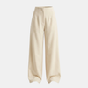 Women’s high waisted tailored wide leg trousers by FJØRNA, featuring a sleek fit and classic wide leg design in neutral fabric.