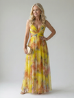 FJØRNA women's sleeveless wrap maxi dress with flowing fabric, perfect for summer, shown hanging on a white background.