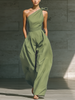 FJØRNA women's cotton-linen one-shoulder jumpsuit with tie waist and wide-leg pants, shown on a model.