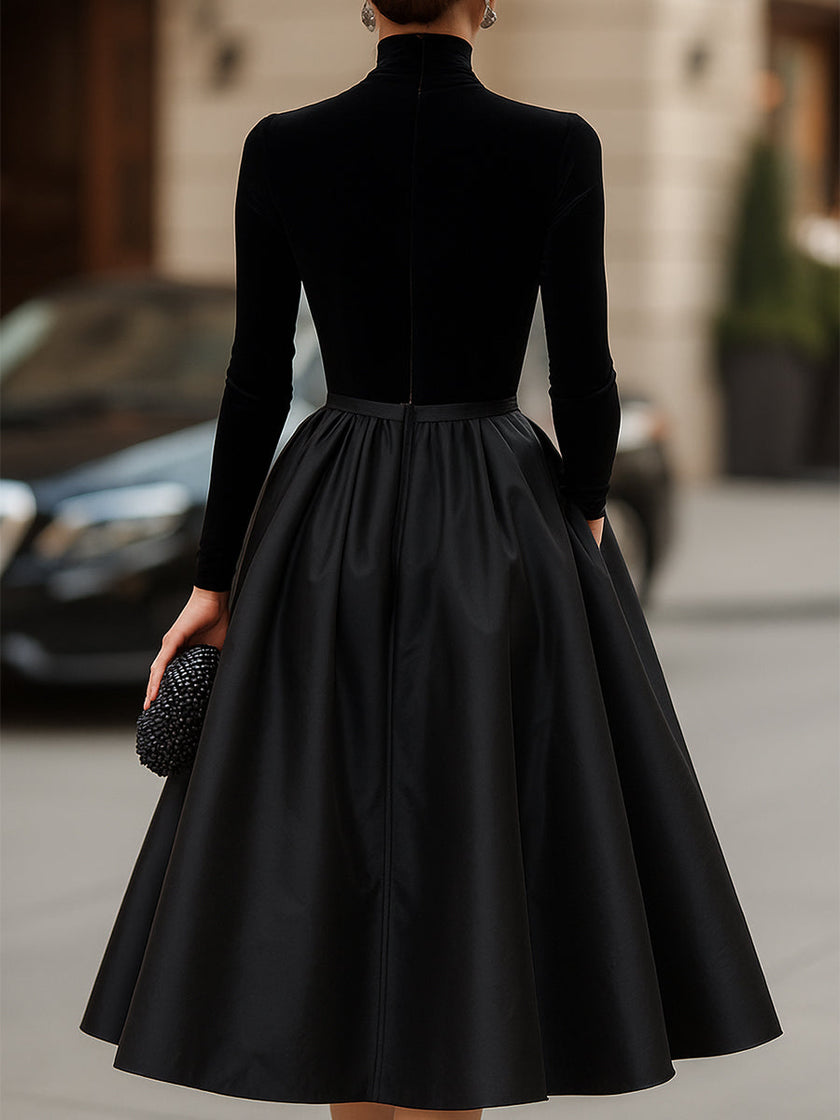 Elegant black velvet and satin midi dress for women by FJØRNA, featuring a sleek design and sophisticated fit.