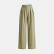 Women’s high waisted pleated wide-leg trousers by FJØRNA, featuring flowing fabric and a stylish, relaxed fit.