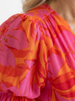 FJØRNA summer midi dress for women with floral pattern and puff sleeves, perfect for warm weather and casual outings.