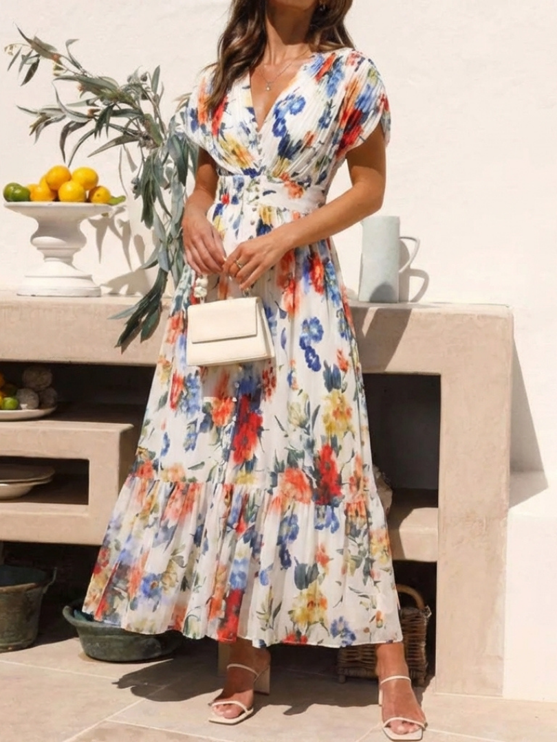 FJØRNA women's floral pleated summer midi dress with lightweight fabric and adjustable straps, perfect for warm weather.