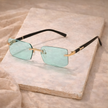 Unisex retro sunglasses from FJØRNA featuring a classic design with dark tinted lenses and stylish frames.