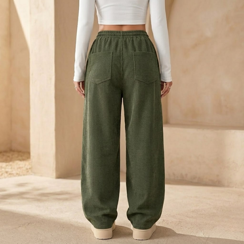 FJØRNA men's corduroy wide leg trousers with relaxed fit, showing the textured fabric and full-length style.